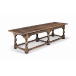 A LARGE OAK SIX-LEG REFECTORY TABLE
LATE 19TH CENTURY
With plank top, interlocking friezes with