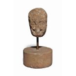 A SANDSTONE BUST
POSSIBLY CELTIC
Set of a steel and stone stand
13 ½ in. (34 cm.) high overall