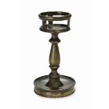 A BRONZE CANDLESTICK
PROBABLY ENGLISH, 15TH CENTURY
With an unusual galleried top and baluster stem,