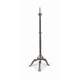 A FRENCH FLOOR-STANDING WROUGHT-IRON CANDLESTICK
PROBABLY 16TH CENTURY
With Gothic arched cabriole