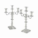 A PAIR OF WILLIAM IV SILVER THREE-LIGHT CANDELABRA WITH VICTORIAN ADDITIONS
MARK OF J. WATSON & SON,