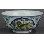 Chinese enamel porcelain bowl, with qilins in the underglaze blue reserve panel over a white ground,