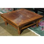 Chinese wooden square low table, possibly 16th/17th century, having floating top panels within an