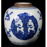 Chinese blue and white porcelain jar, with child and lotus in reserve over the tendril decorated