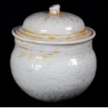 Chinese qingbai type ceramic covered jar, body with molded leafy scrolls, the domed lid with thunder