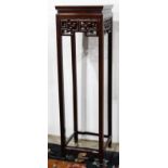 Chinese wooden flower stand, with a square floating top panel, above a scroll apron and tall