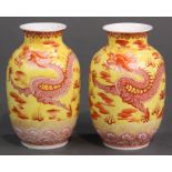 Pair of Chinese yellow and red enameled porcelain vases; the ovoid bodies each with a red dragon