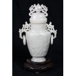 Chinese hardstone vase, carved with peonies to the body, having pierced tendril handles with loose