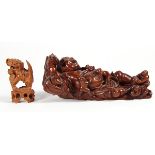 (lot of 2) Chinese wooden carvings, one of a fu-lion with a brocade ball; together with a figural