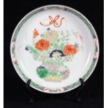 Chinese famille verte enameled porcelain dish, decorated with a flower basket, the interior side