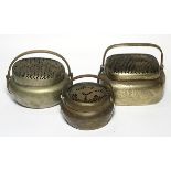 (lot of 3) Chinese brass hand warmers, one circular form etched with flowers; an oval form with