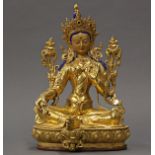 Himalayan gilt bronze Tara, seated in royal ease on a lotus throne and holding two lotus sprigs,