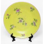 Chinese porcelain plate with yellow sgraffito ground, with pink floral sprays on the incised ground,