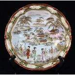 Japanese Kutani porcelain shallow bowl, foliate rim, decorated with scenery of a pavilion by a