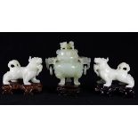 (lot of 3) Chinese hardstone carvings, consisting of a pair of mythical beasts, with wood stands;