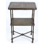 Continental patinated bronze two tiered stand circa 1880, the rectangular top with circular
