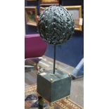 Moderne patinated metal figural scupture of a tree, having a stylized spherical crown, above a