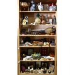 Six shelves of decorative items including picture frames, a continental floral decorated