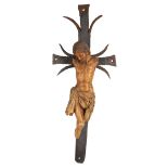 (Lot of 2) Spanish Colonial style carved wood crucifixes, 19th Century, each mounted on a stylized