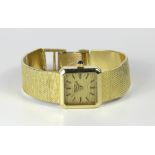 Lady's Seiko 14k yellow gold quartz wristwatch; Dial: yellow textured, applied baton indexes,