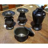 (lot of 4) Group of Japanese bronze items: the first, a jar with handles to the top; the second