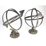 Pair of French wrought iron armillary spheres, consisting of a spherical framework of rings that