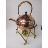 An Art Nouveau copper spirit kettle on original brass stand