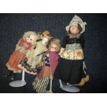 4 Bisque head dolls to include parian