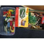 An assortment of vintage diecast vehicles and box of vintage farm animals