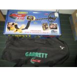 A Garrett Ace metal dector with accessories