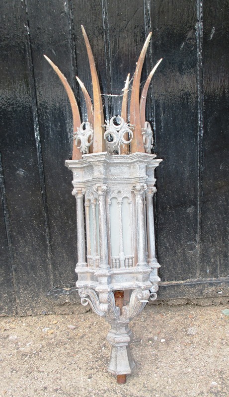 An early 20th century post cap light fitting