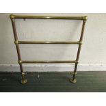 A vintage brass heated towel rail