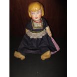 A 1930's  small bisque head doll