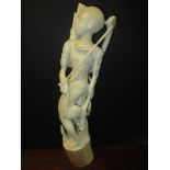 An early 20th century Nigerian carved ivory figure of a warrior, approx 18 inches 46cm tall