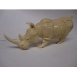 A  fine detailed Nigerian carved ivory figure of a Rhino, approx 20cm dating early 20th century