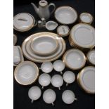 An 8 place setting dinner & tea service by Noritake in the Gold Ridge design