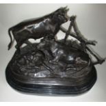 A bronze bovine sculpture, signed to left