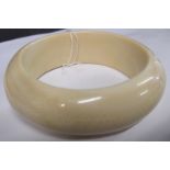 A 1920's ivory bangle