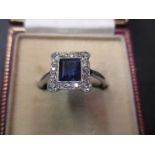 An Art Deco 18ct white gold and diamond ring set with large central sapphire