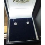 A pair of diamond stud earrings mounted in 18ct gold