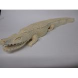 An early 20th century Nigerian  carved ivory Crocodile, approx 34cm long