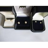 Three pairs of gold and pearl stud earrings