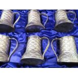 A set of 800 grade silver tankards in case, approx silver weight 1320g