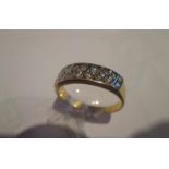 A gents 18ct yellow gold ring set with 16 diamonds