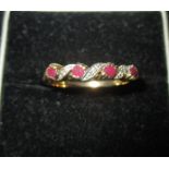 A 9ct gold diamond and ruby ring