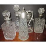 4 lead crystal decanters and a claret jug