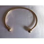 A 9ct gold torque wrist bangle, approx 11g