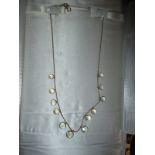 A 9ct gold necklace set with moonstone discs