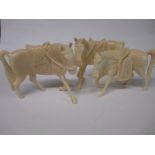 Three Nigerian carved ivory horse figures, approx 11cm long