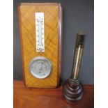 An industrial therometer and wall mounted Barometer